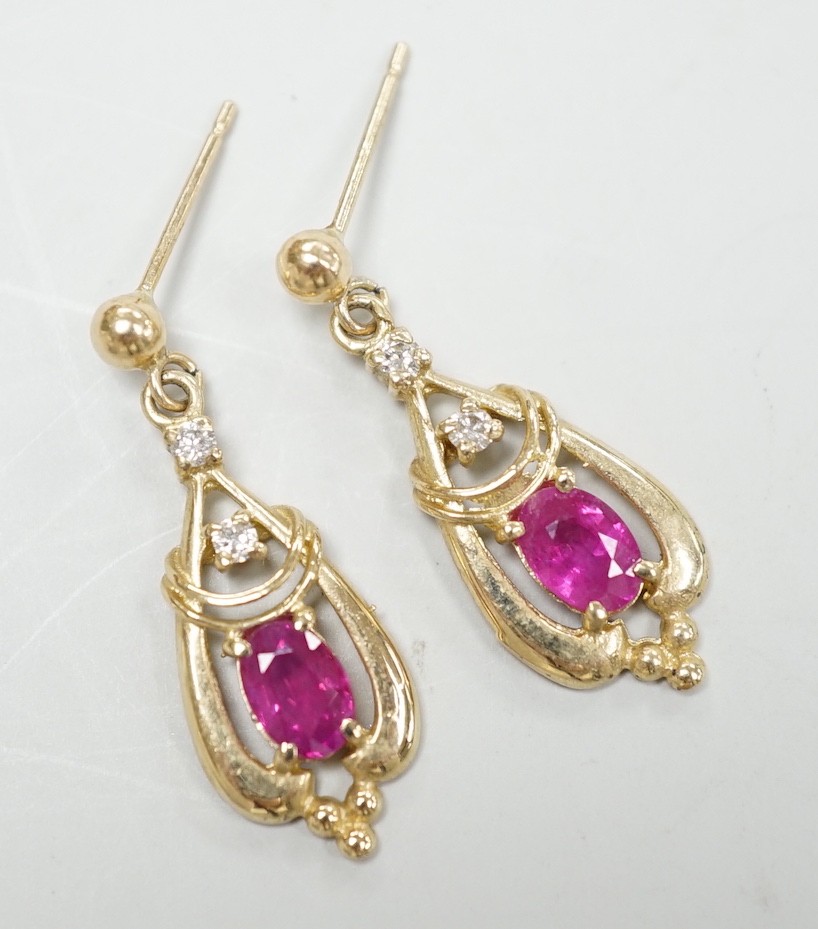 A modern pair of 9ct, ruby and diamond set drop earrings, 26mm, gross weight 2.5 grams.